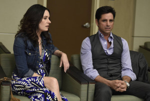 GRANDFATHERED: (L-R) Sara (Paget Brewster) and Jimmy (John Stamos) in the "Pilot" episode of GRANDFATHERED series premier airingTuesday, Sept. 29 (8:00-8:30 PM ET/PT) on FOX. ©2015 Fox Broadcasting Co. CR: Erica Parise/FOX